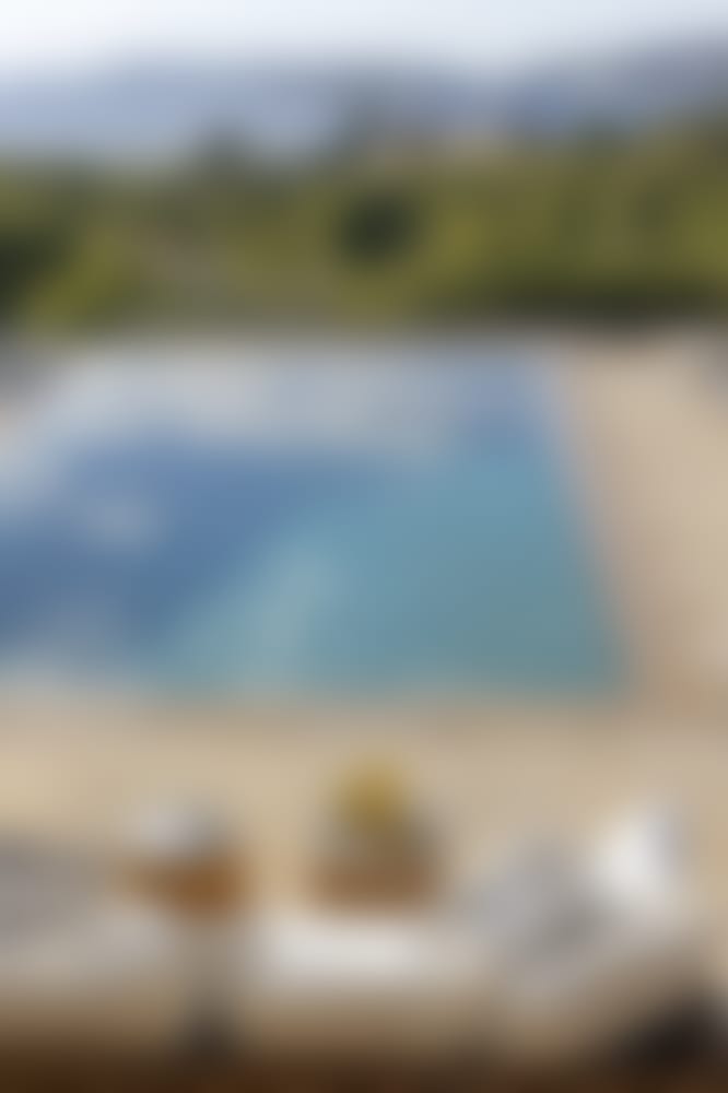 A comfortable sitting area by the pool.